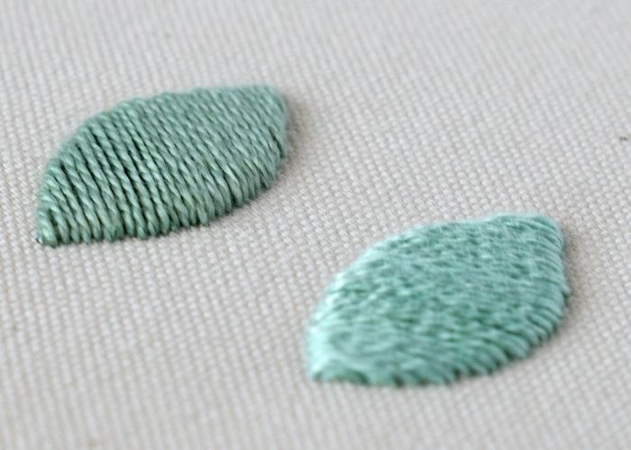 La vidéo de broderie à la main en satin rembourré crée des formes en relief